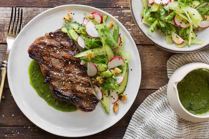 Photo of Simple seared steak with arugula pesto and cucumber-radish salad, one of the delicious recipes featured in Sunbasket's Quick & Easy Meal Plan